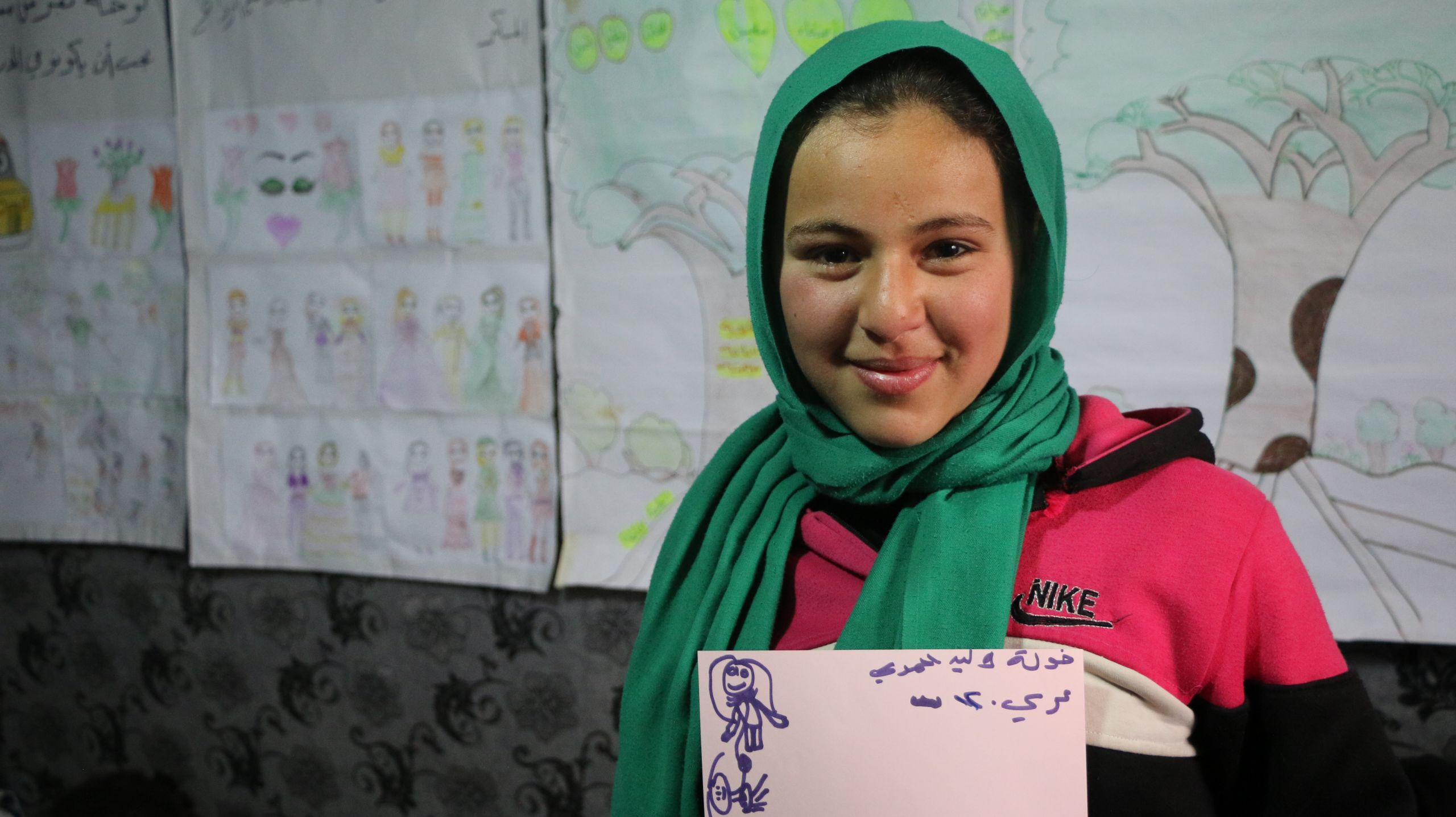 12-year-old Kawla is a Syrian refugee living in an informal tented settlement in Lebanon's Bekaa Valley. She dreams of completing her education and going back to Syria.