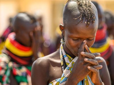 Prayer before a food distribution in Turkana, Kenya