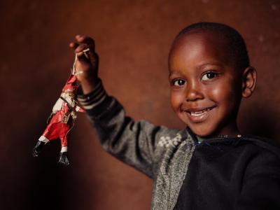 A child showing his Christmas ornament