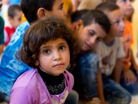 A girl in Syria sits in her classroom