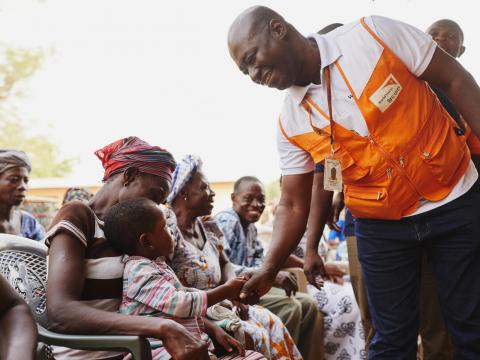 World Vision staff meets with families in Ghana