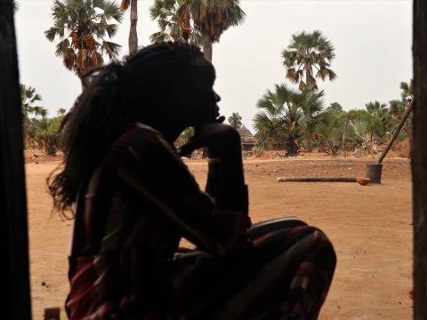 Young lady from South Sudan in deep thoughts.