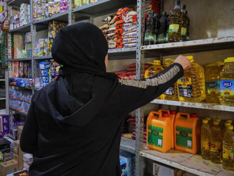 A woman shops in her local market in Syria for basic food necessities. 