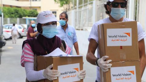 World Vision staff in Beirut go door-to-door to distribute food to families affected by the explosion on Aug. 4