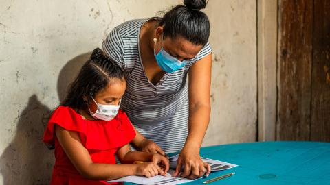 Distributing educational guides in Honduras