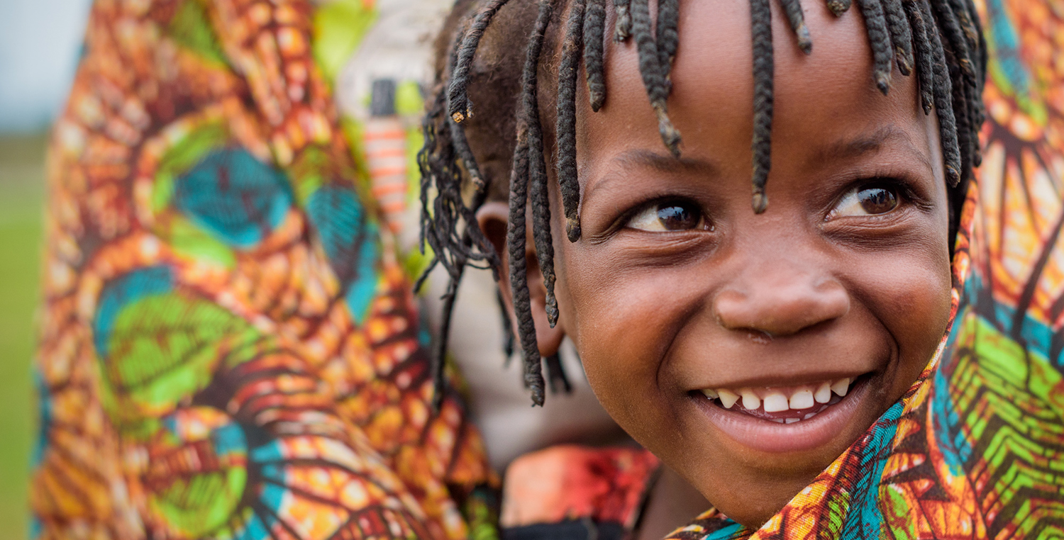 African child held by mother
