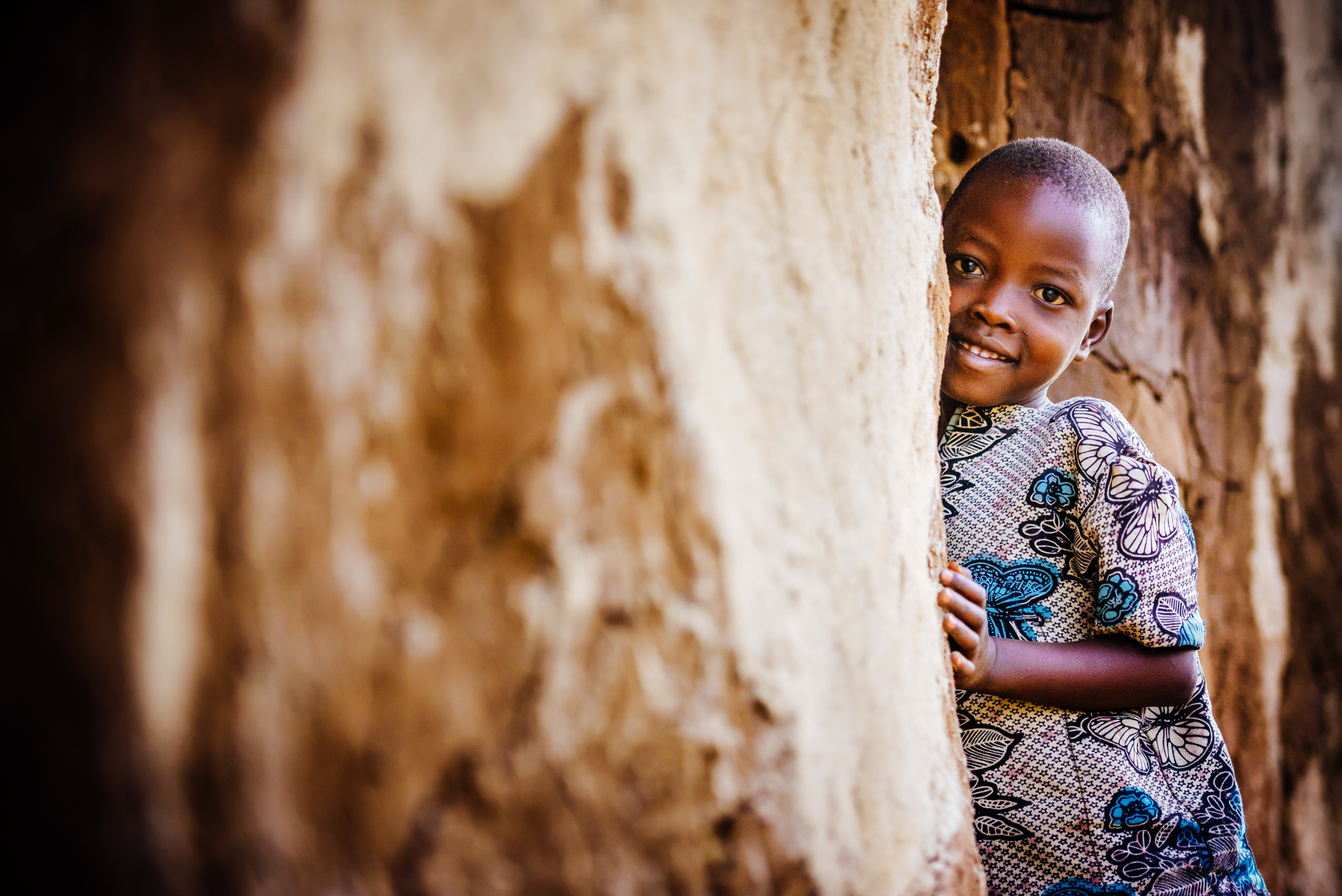 Child smiling in traditional clothing