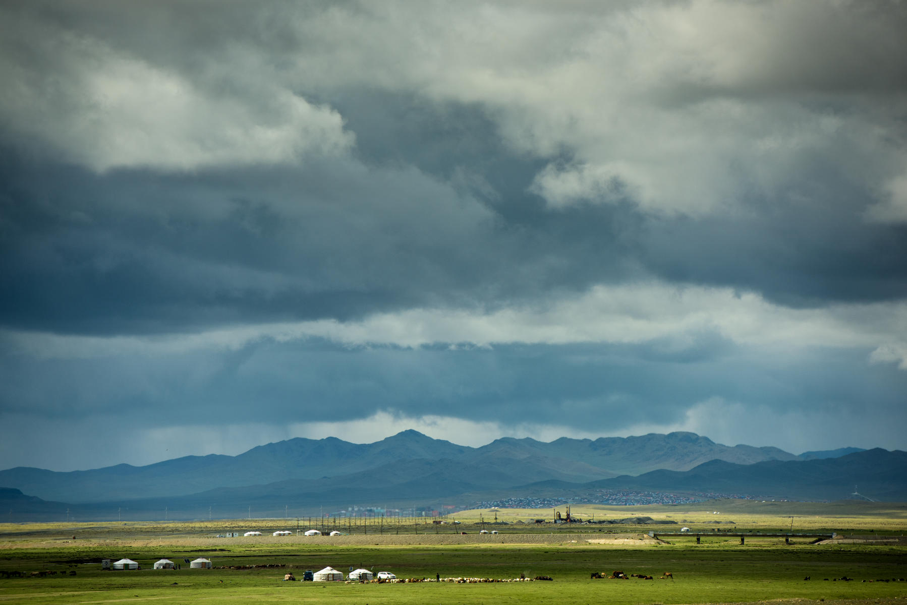 A field with clouds in the sky