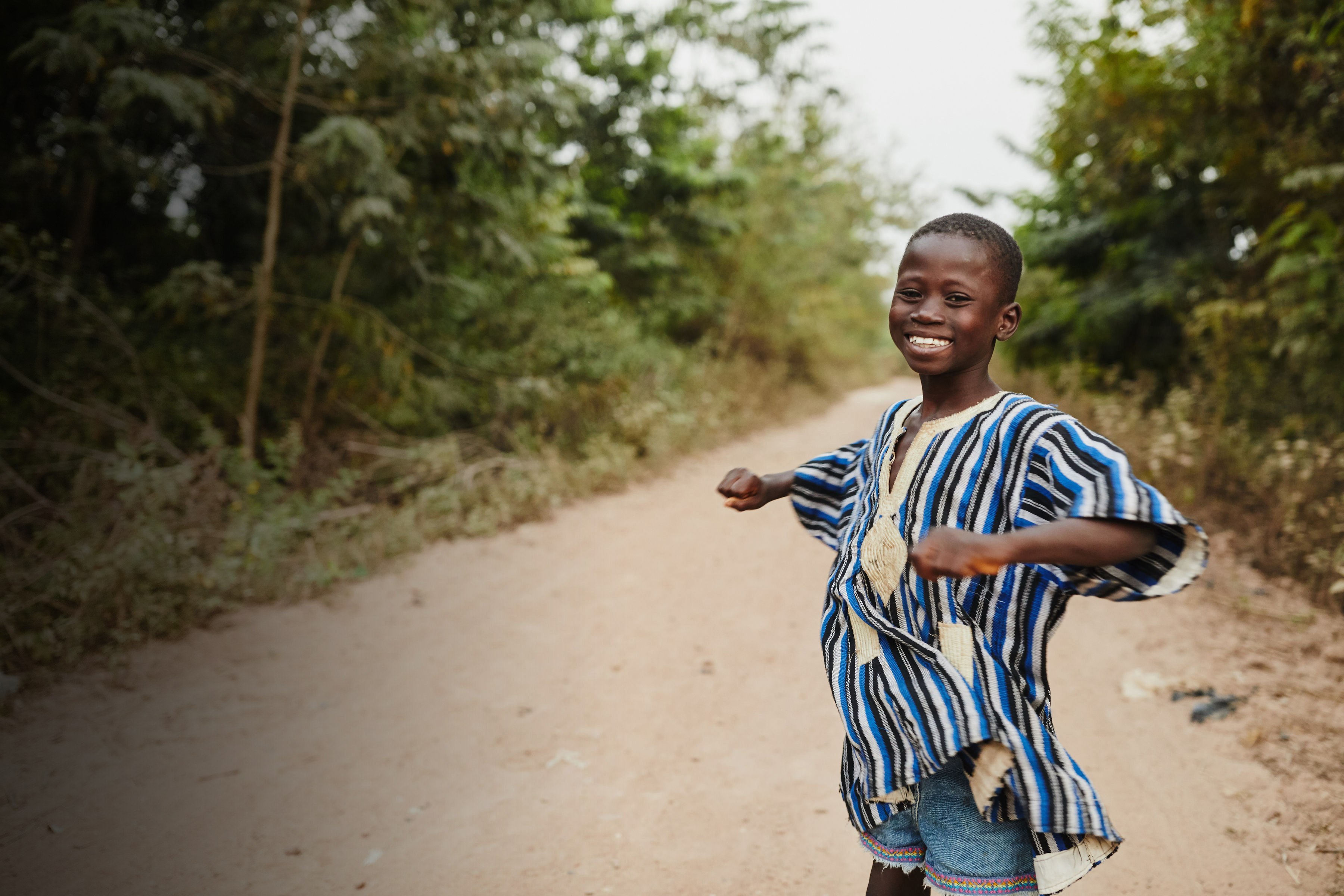 A Boy in Ghana on a road