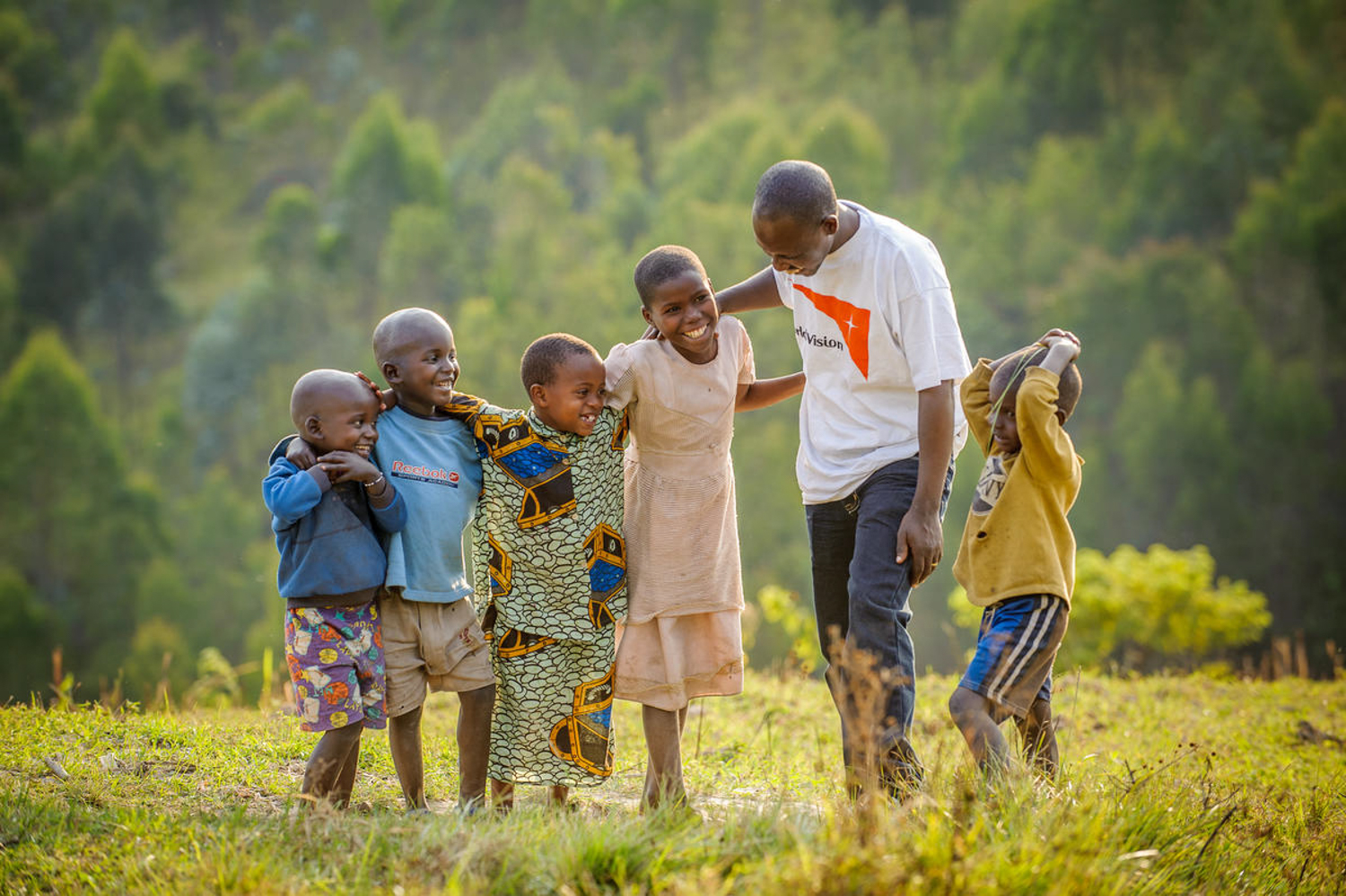 World Vision staff with children