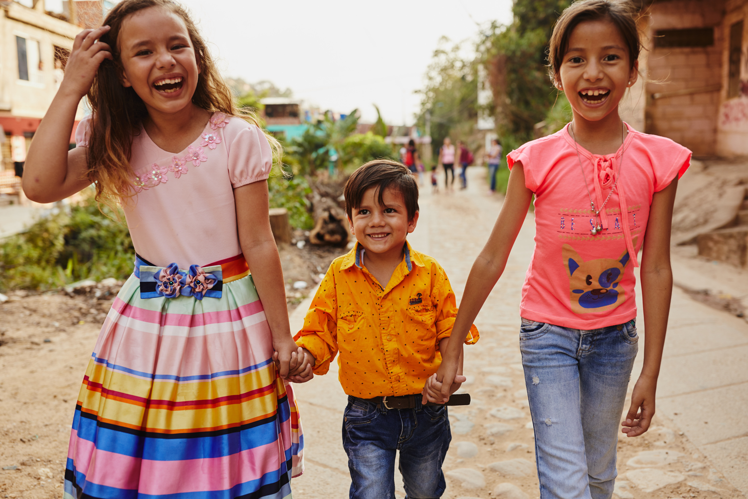 Children walking and holding hands