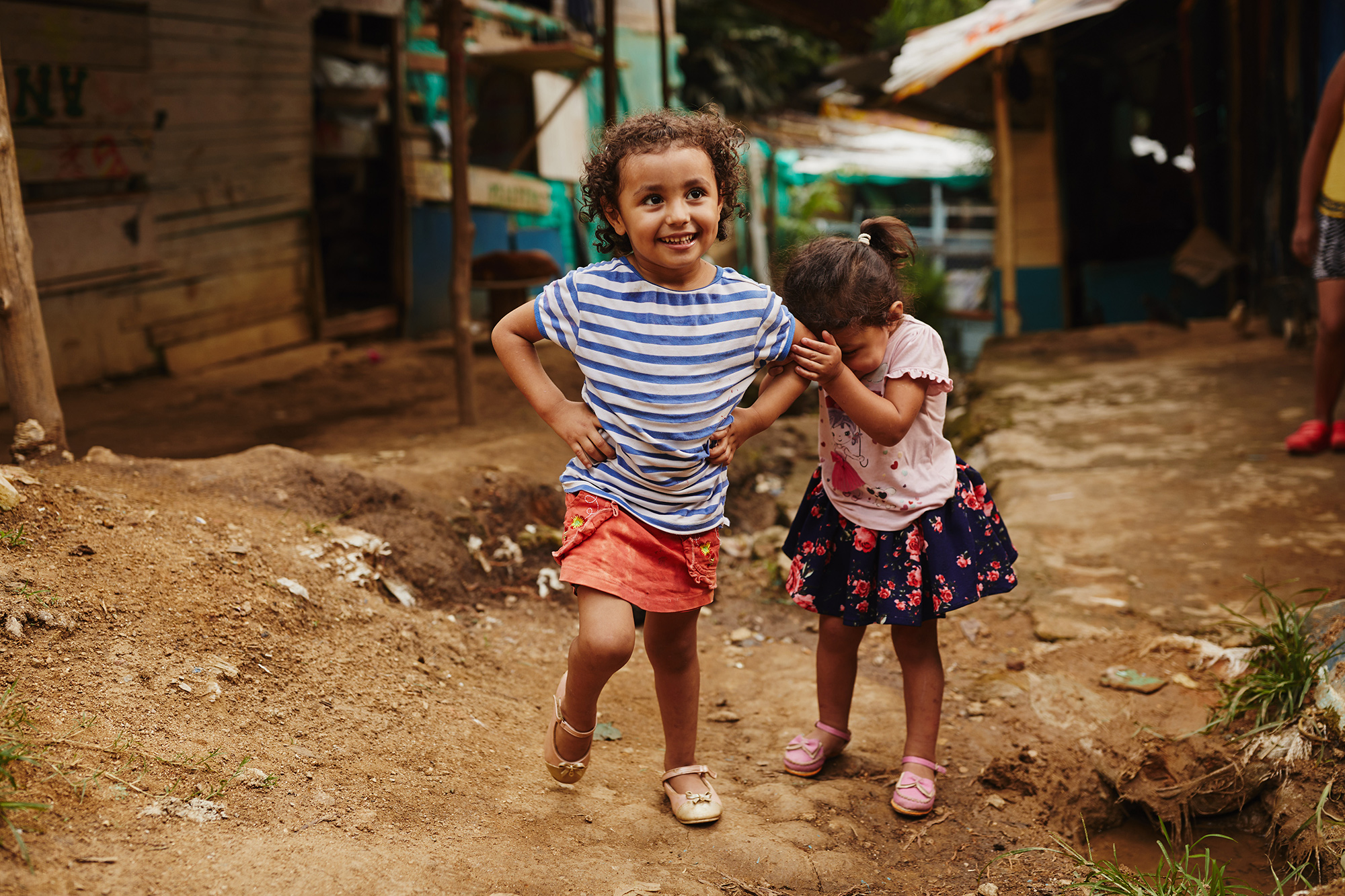 A girl and her sister play in rural Colombia