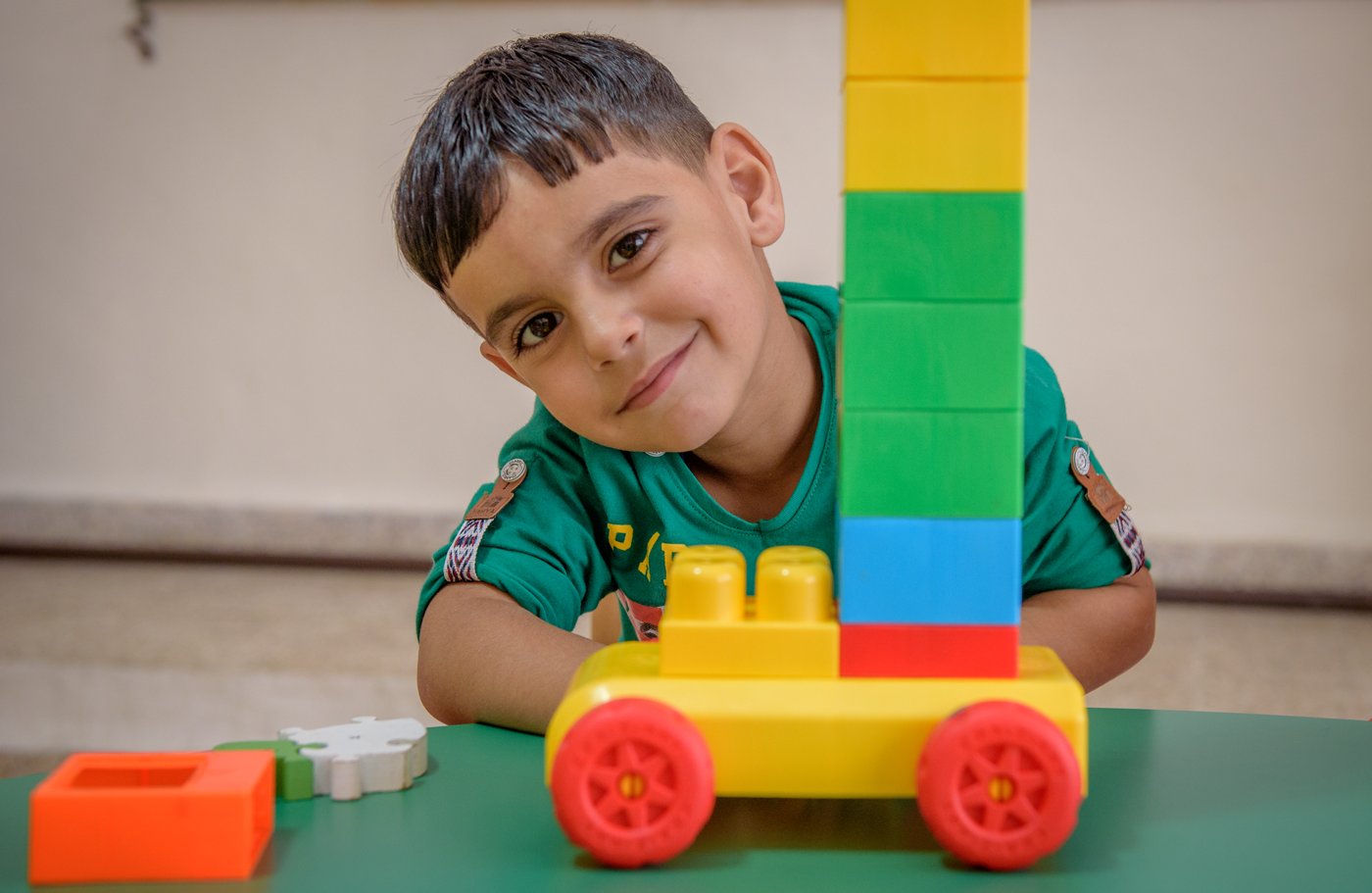 Boy playing with blocks and car
