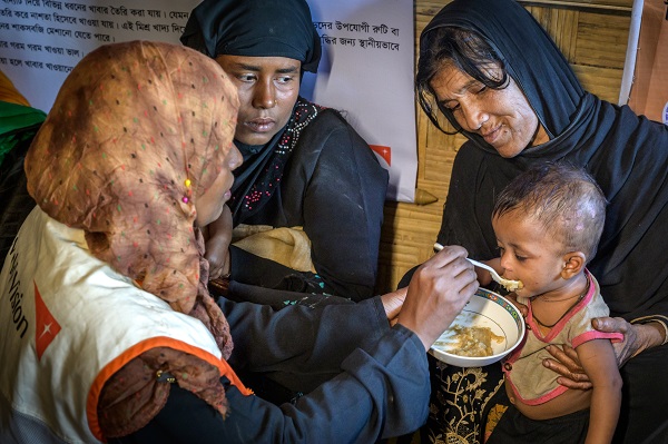 Women feeding a child
