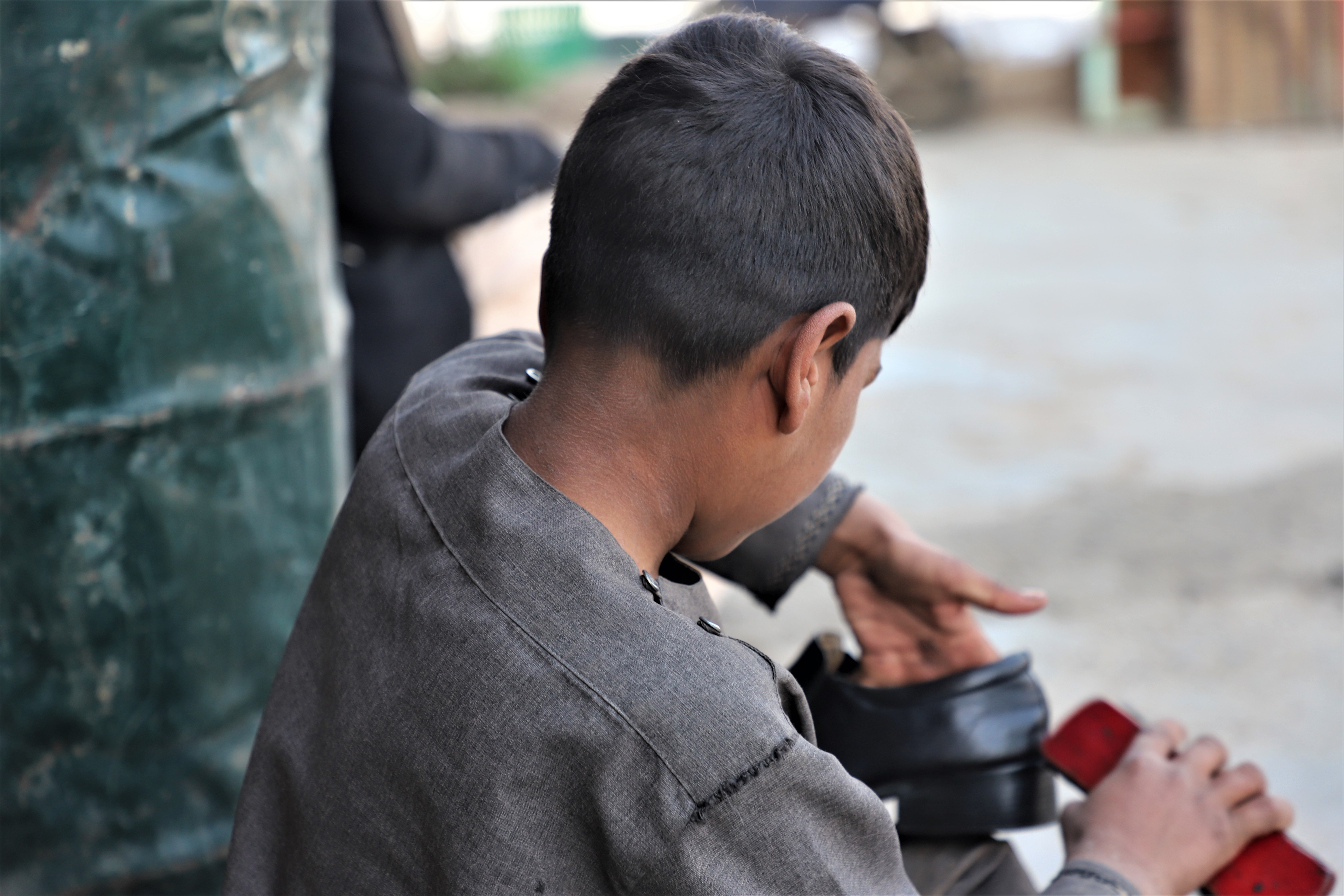 One shoeshine boy s hope for education Afghanistan World Vision International