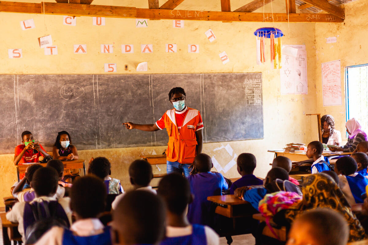 WVI staff member teaches classroom full of children