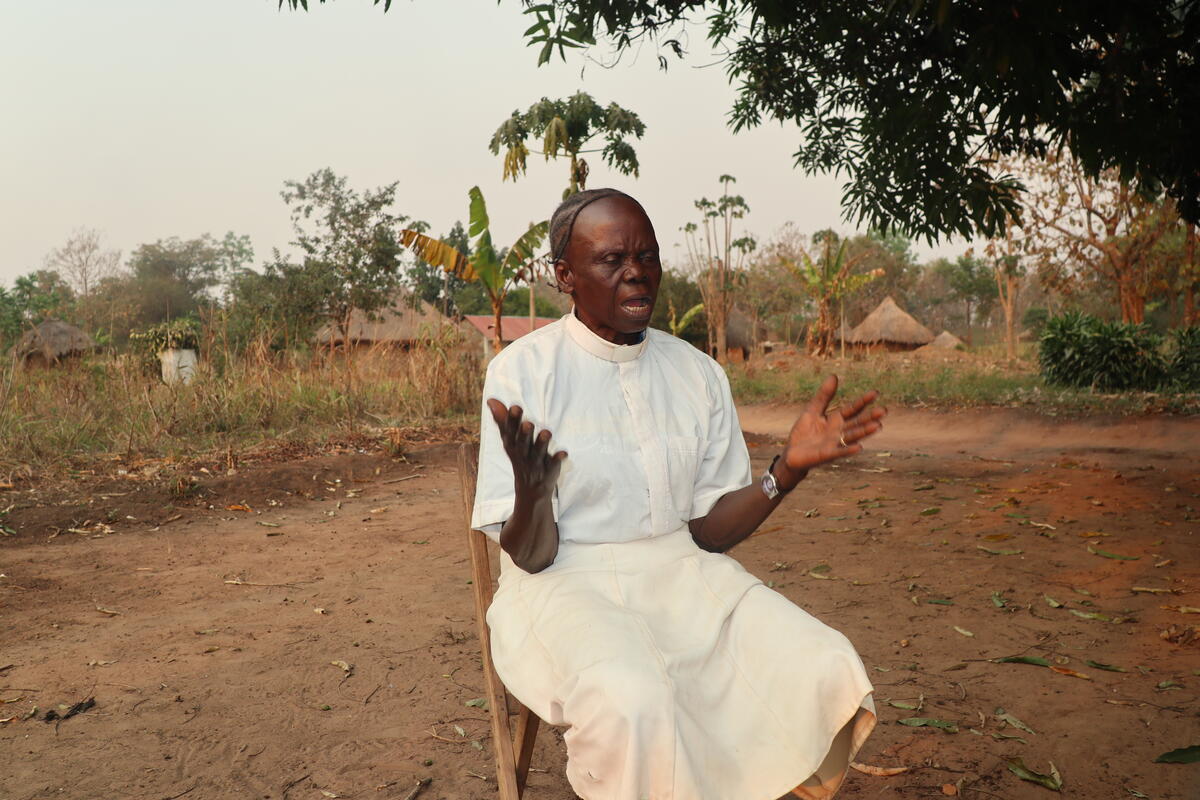 man sits outside and prays