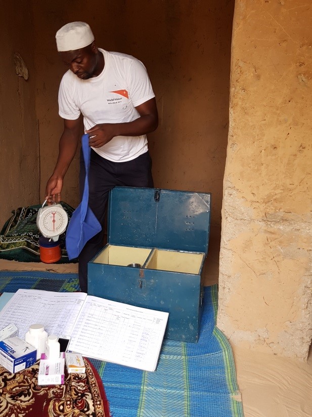 Moussa showcasing the contents in his tool box