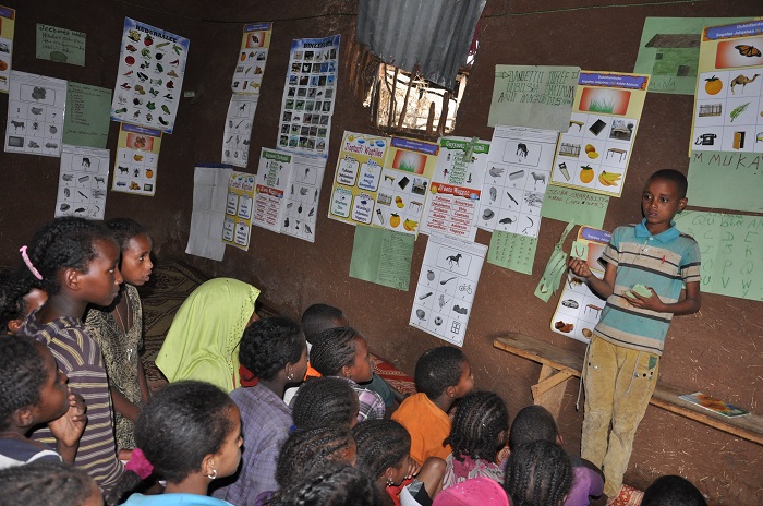 A boy leads a reading club in Ethiopia
