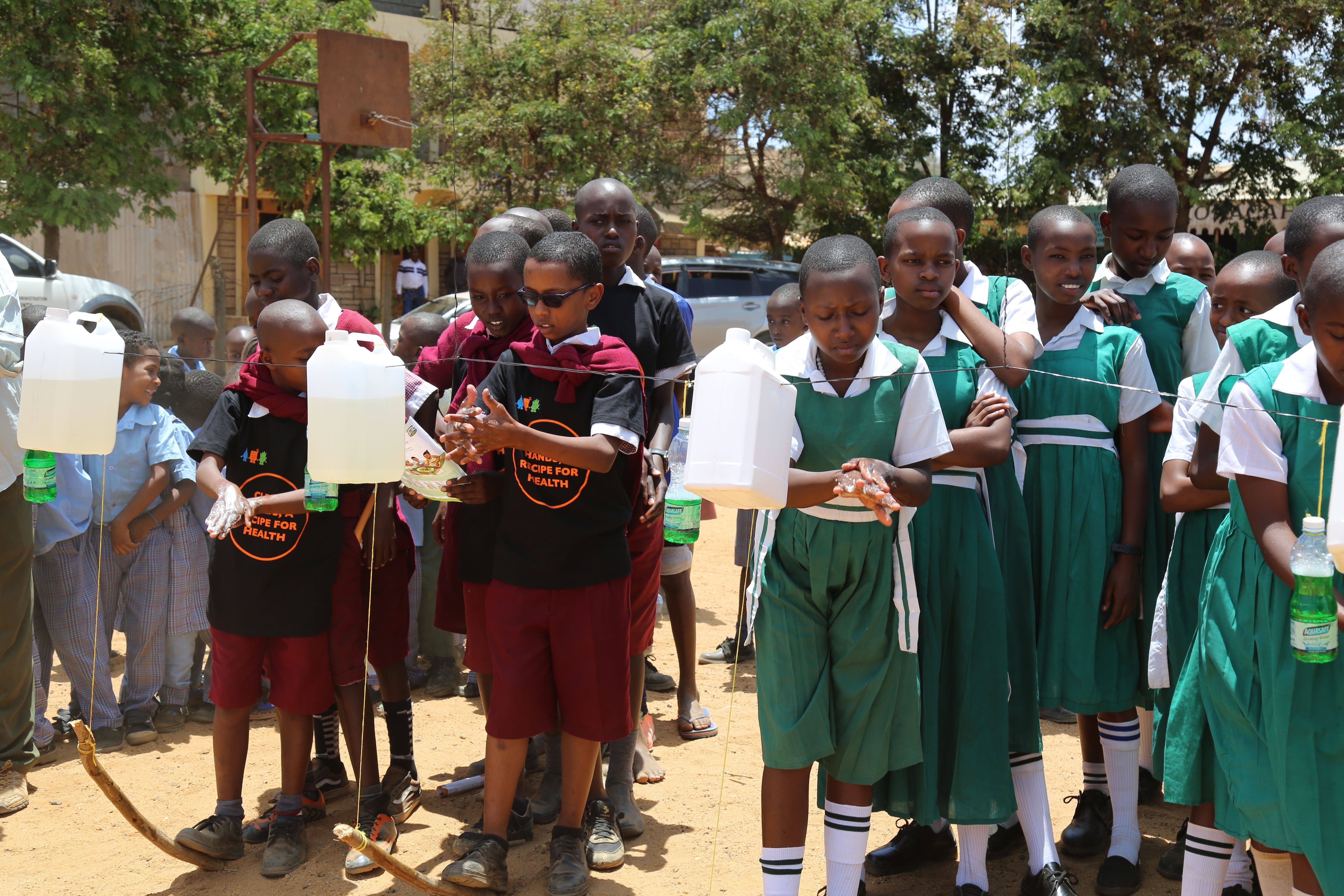 School children in Kitui County washing their hands with soap and water from tippy taps during the 2018 Global Handwashing Day celebrations in Kenya. ©2018 World Vision/ Photo by Susan Otieno