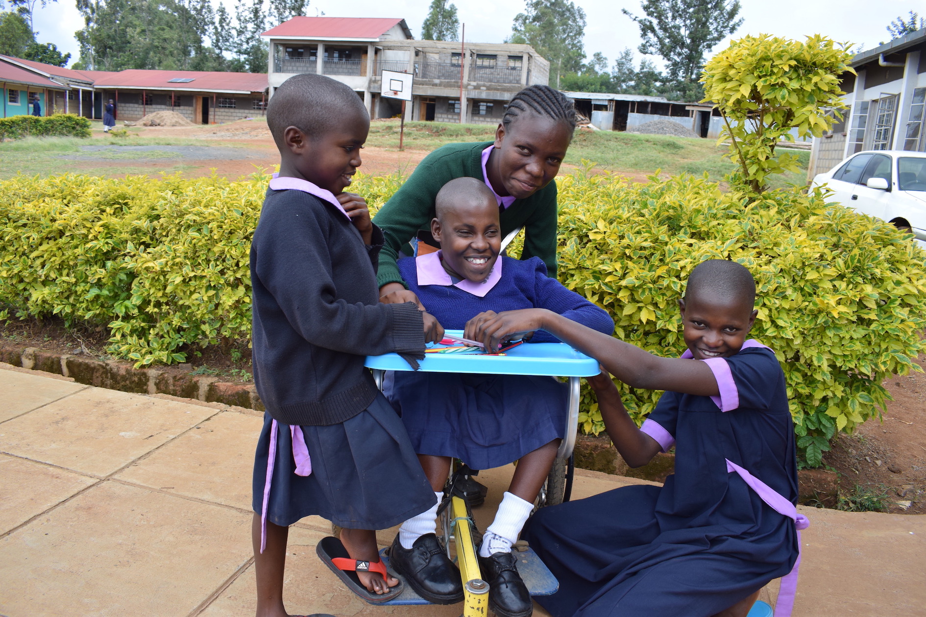 As a result of the wheelchair she received from World Vision, Isabella,13, from Western Kenya is now able to play with friends and enjoy life. ©2018 World Vision/Photo by Sarah Ooko.