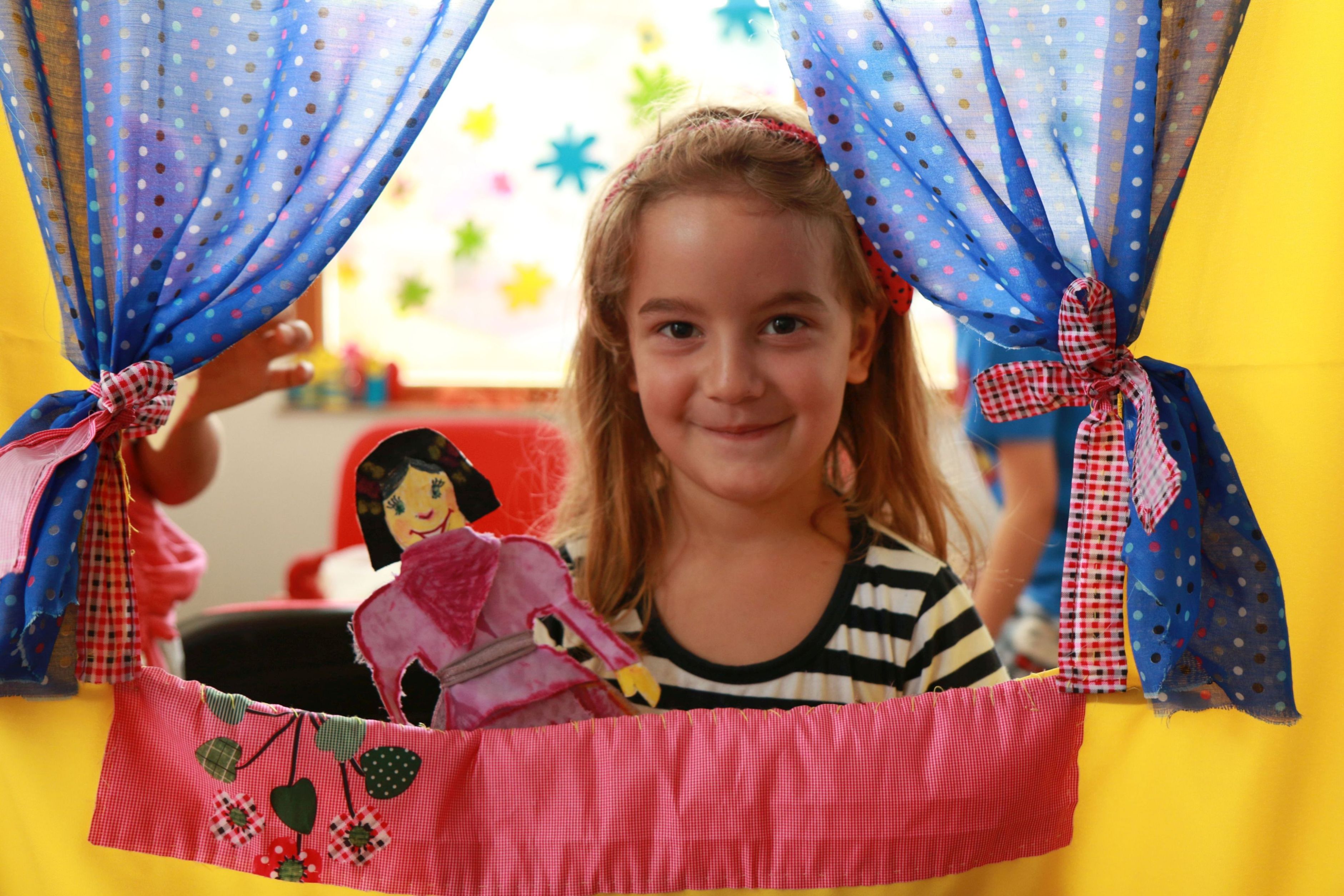 Katja is participating in a small-scale puppet show