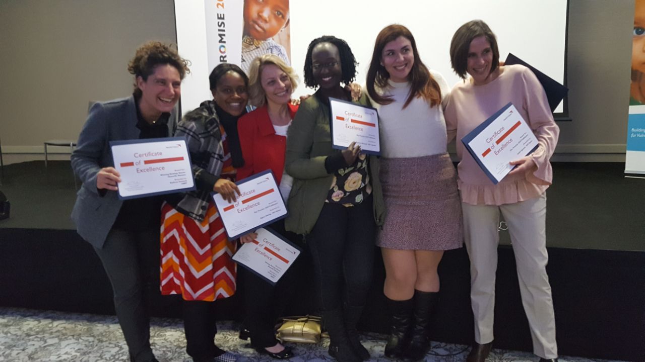 Agnes (2nd left) displaying her award with other winners