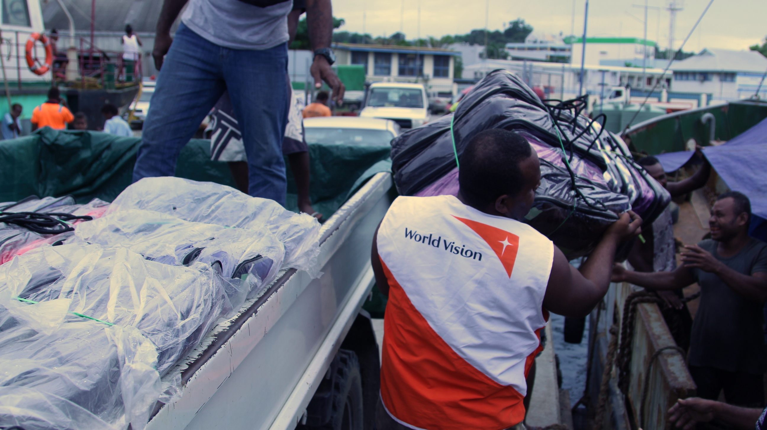 Hygiene kits bound for Makira are loaded to a ship chartered by the National Disaster management Office. Photo: Langi Pitia/World Vision  