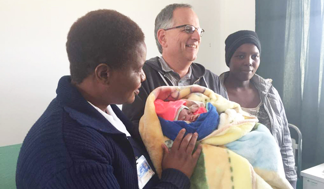 From Left: Local nurse who assisted Bekezel in delivering the baby. Centre World Vision Zimbabwe National Director Emmanuel Isch and Bekezela (Far Right).