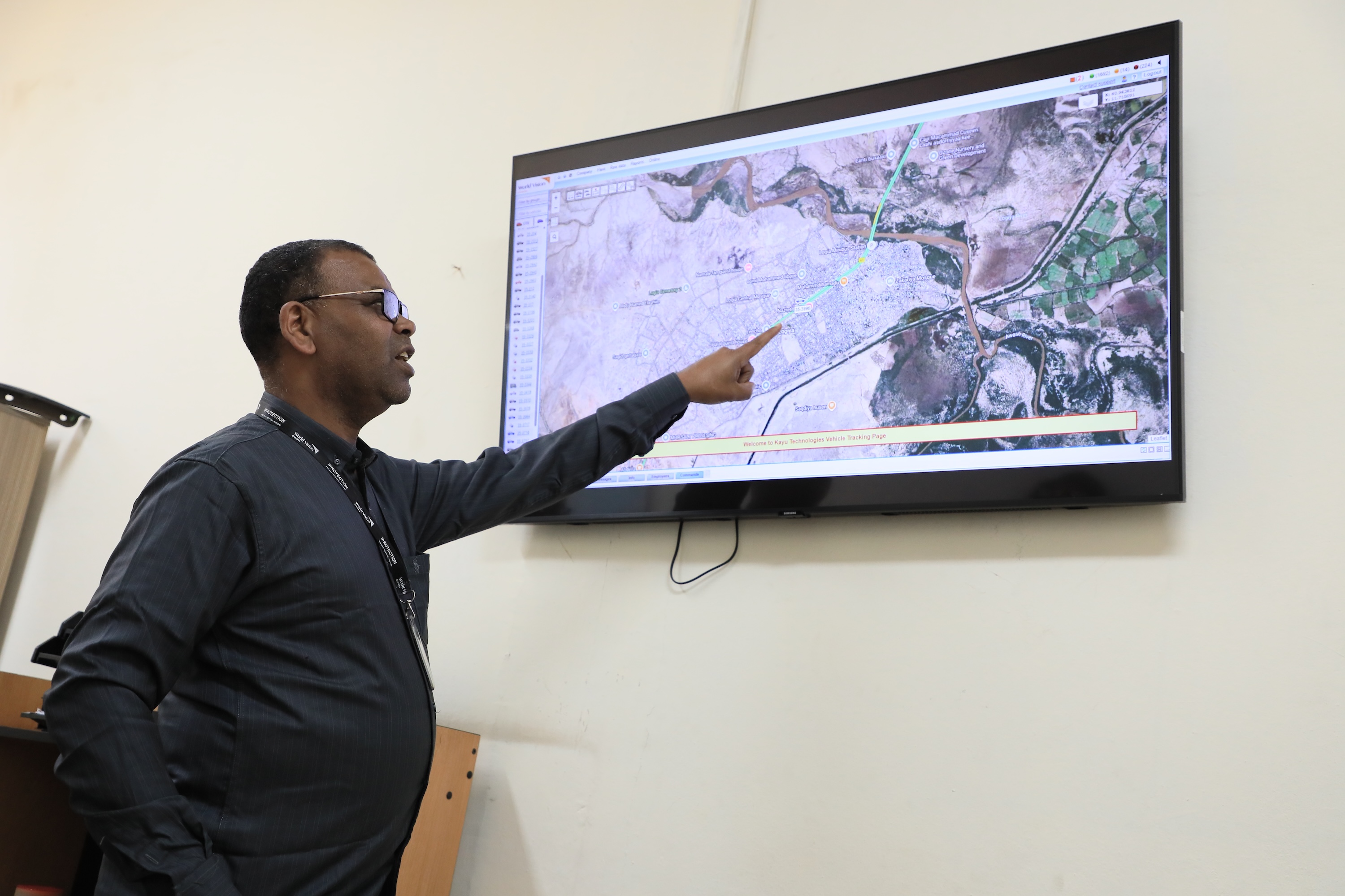 A staff checking GPS and vehicle tracking systems