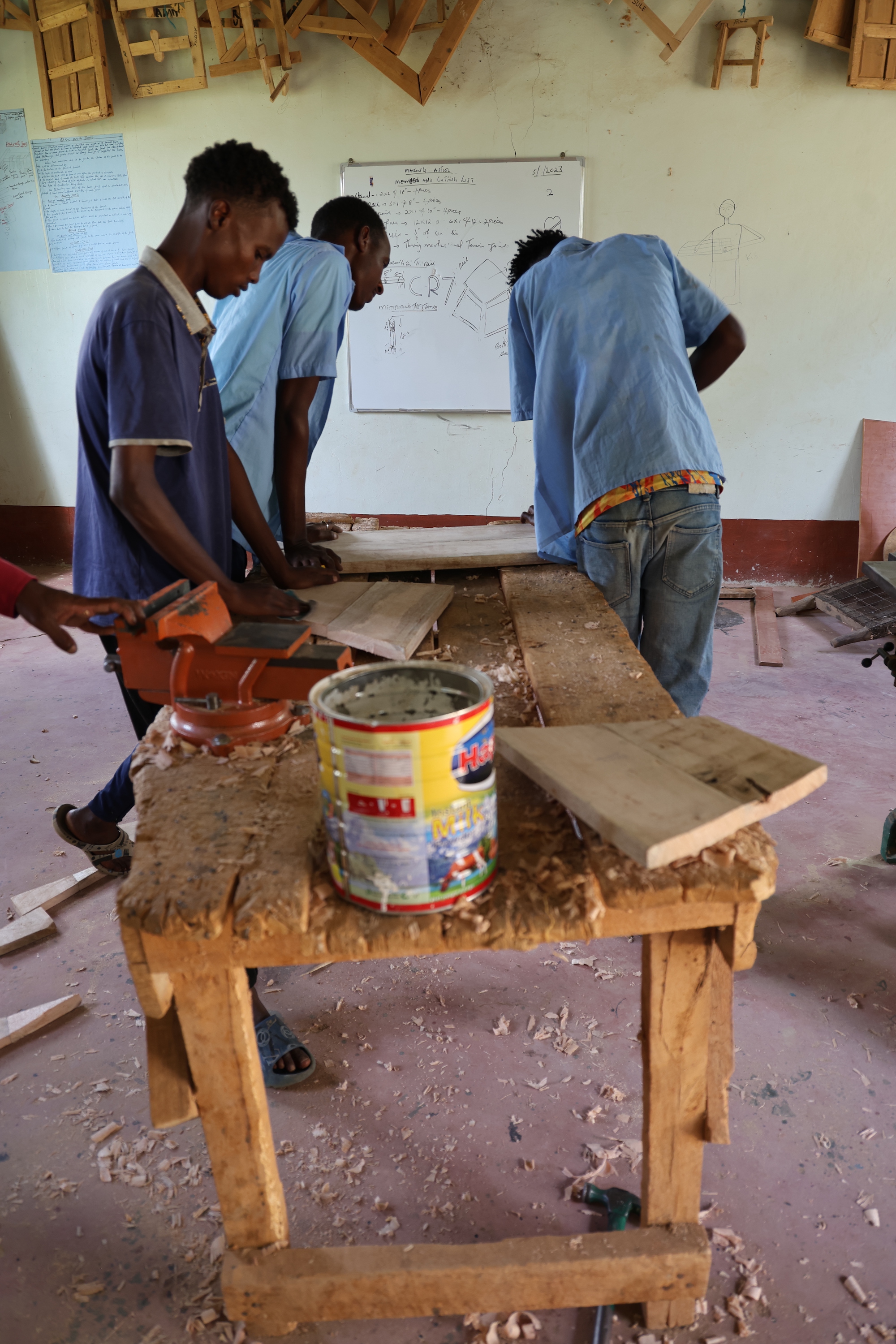 One of the students at work in a workshop