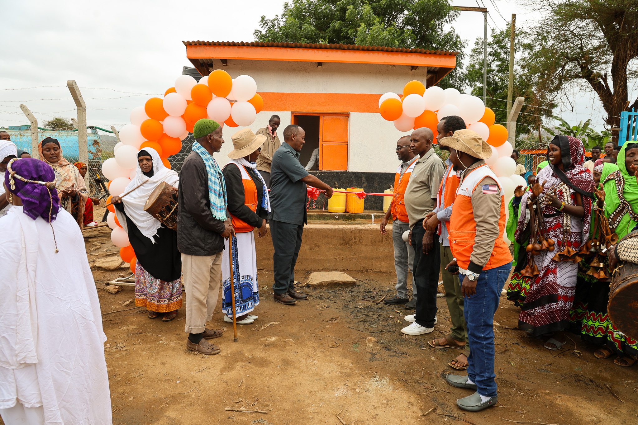 Photo Caption: World Vision Kenya staff members, along with community members, joined Mr. Dida Golicha, the Golbo Ward Administrator in Moyale Sub-County, for the official handover of the Odda Water Borehole and water Kiosk renovated by World Vision Kenya in partnership with the International Organization for Migration (IOM) Kenya) at Odda Village in Moyale Sub-County, Marsabit County. © World Vision Photo/Jared Ontobo
