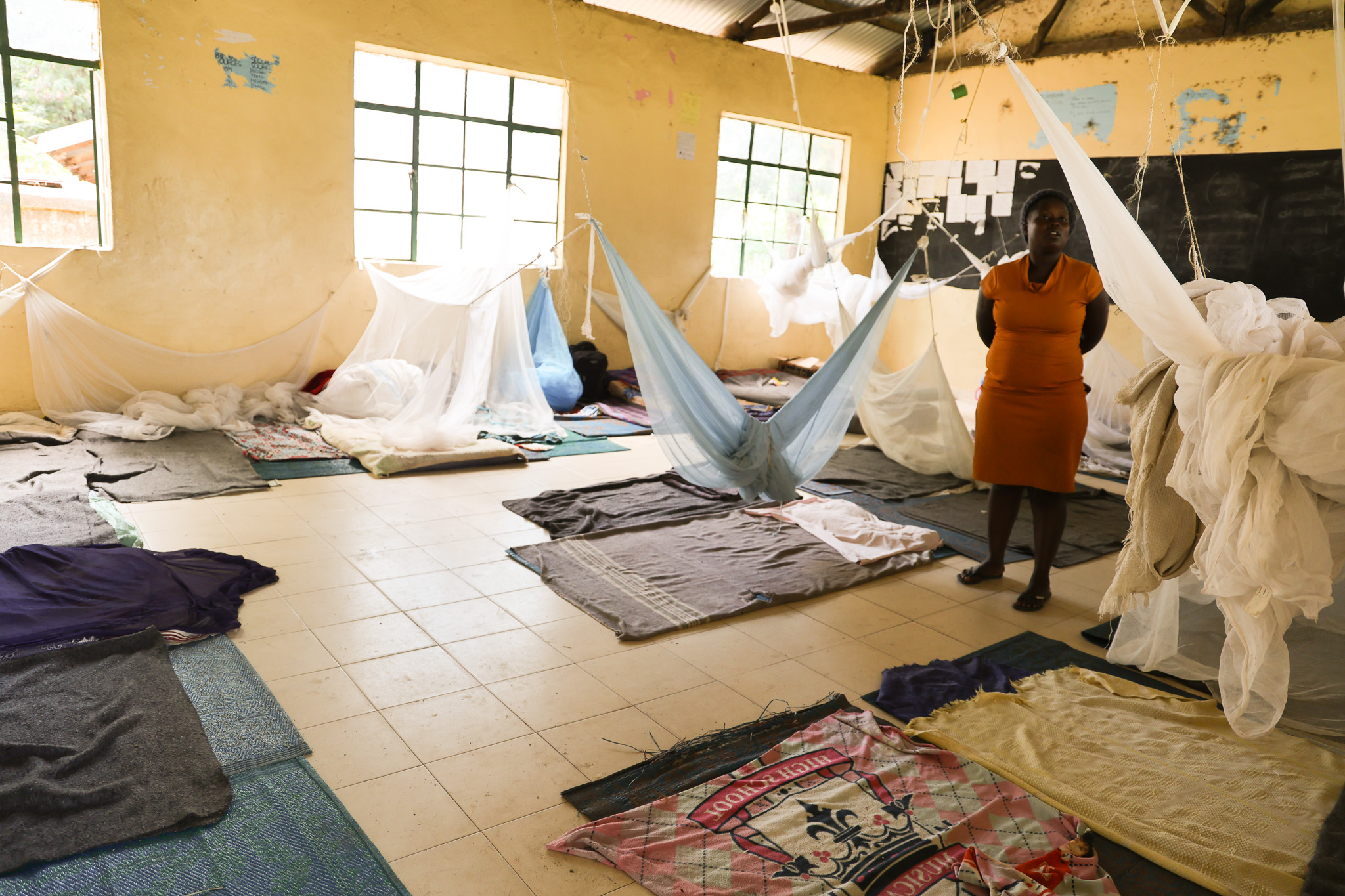 : Displaced Parents with their children at Kobuya Primary School classroom in Rachuonyo Sub-County in Homabay County. 