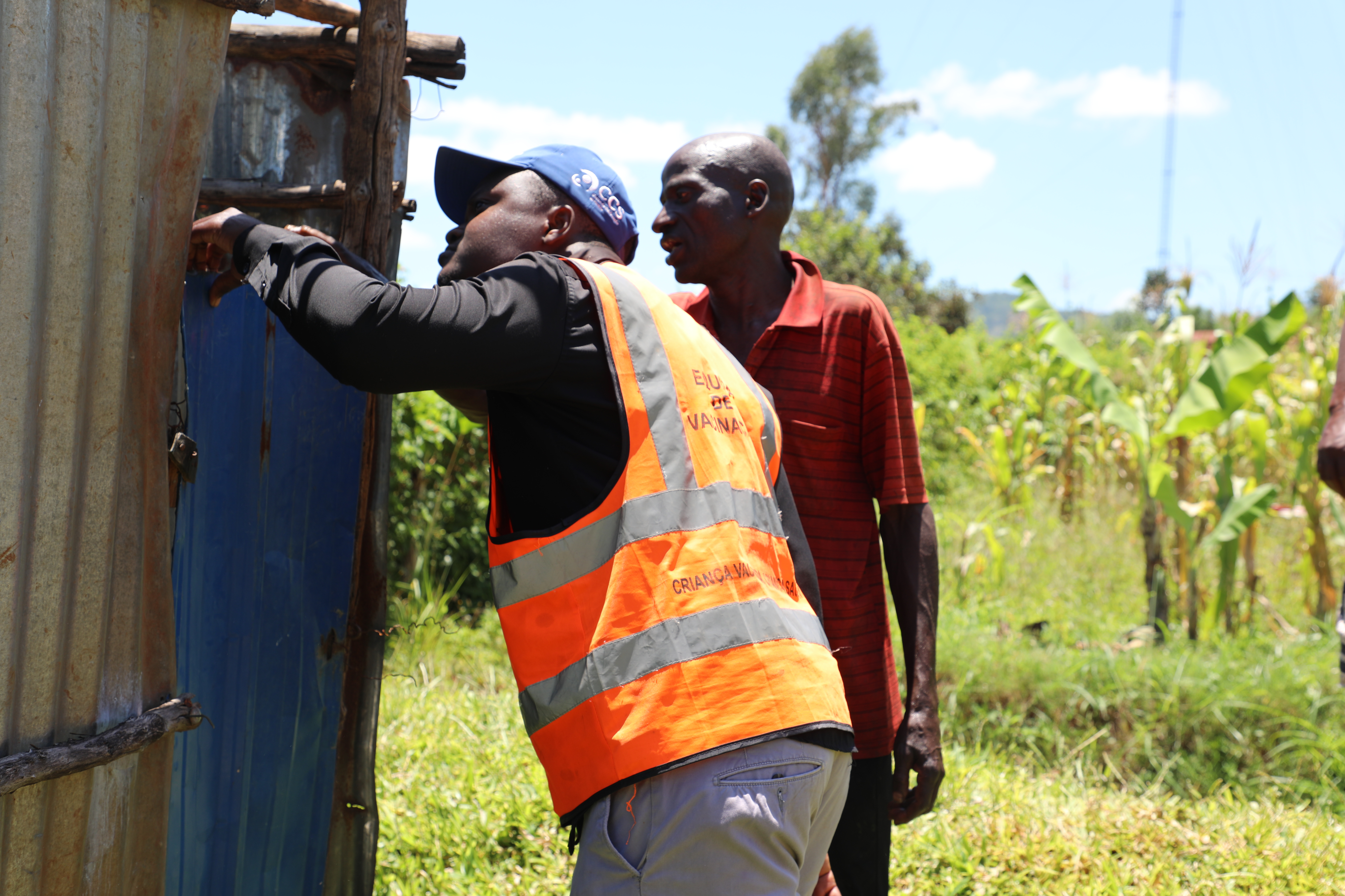 Alfredo showing his yard and separated latrines 