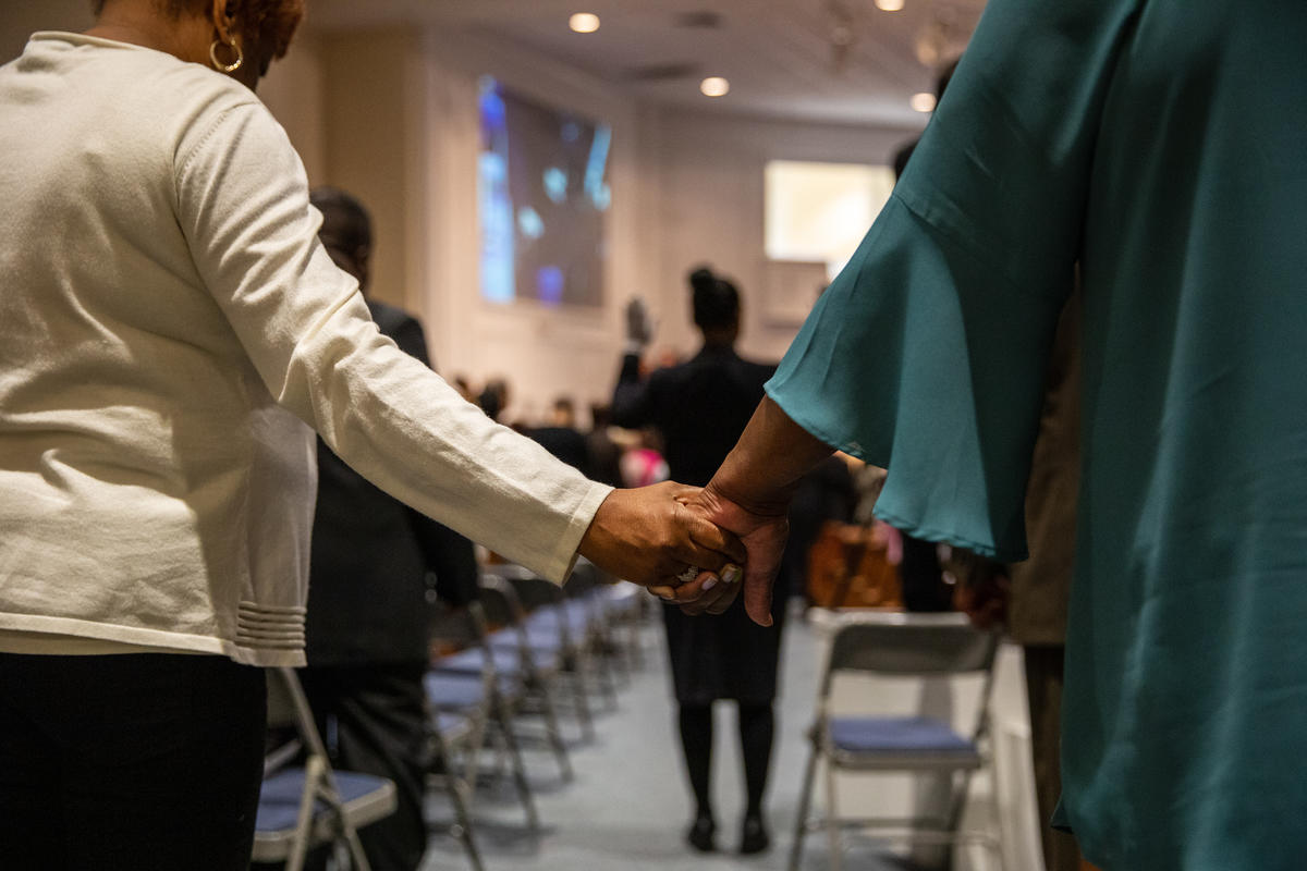 Holding hands in prayer 