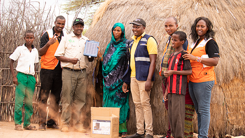 Obadiah Kisang, Director of World Vision's IMARA programme (third from Left)  with World Vision staff at one of the homes where children benefited from solar technology products. ©World Vision Photo/Wesley Koskei.