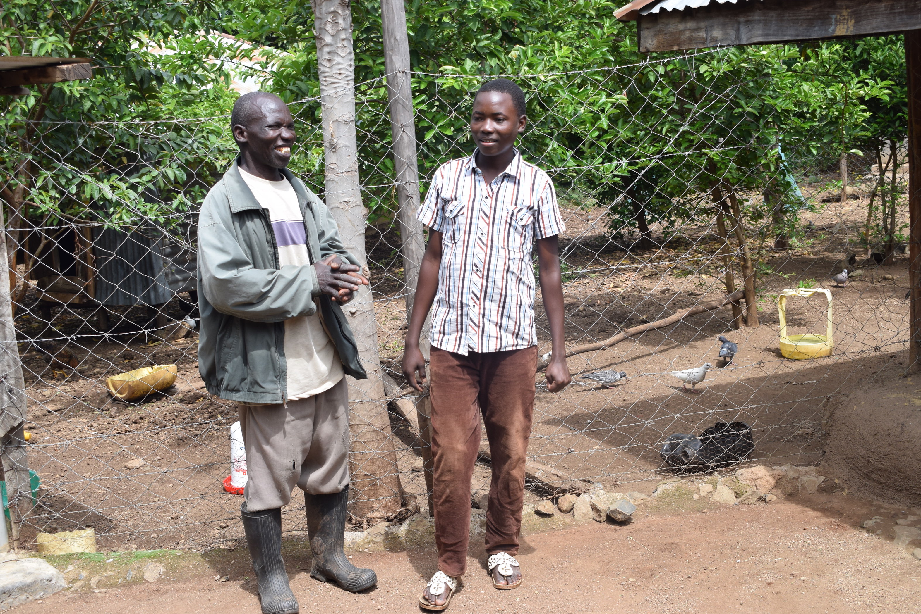 James talking to his son Tobias (right). World Vision/Photo by Sarah Ooko