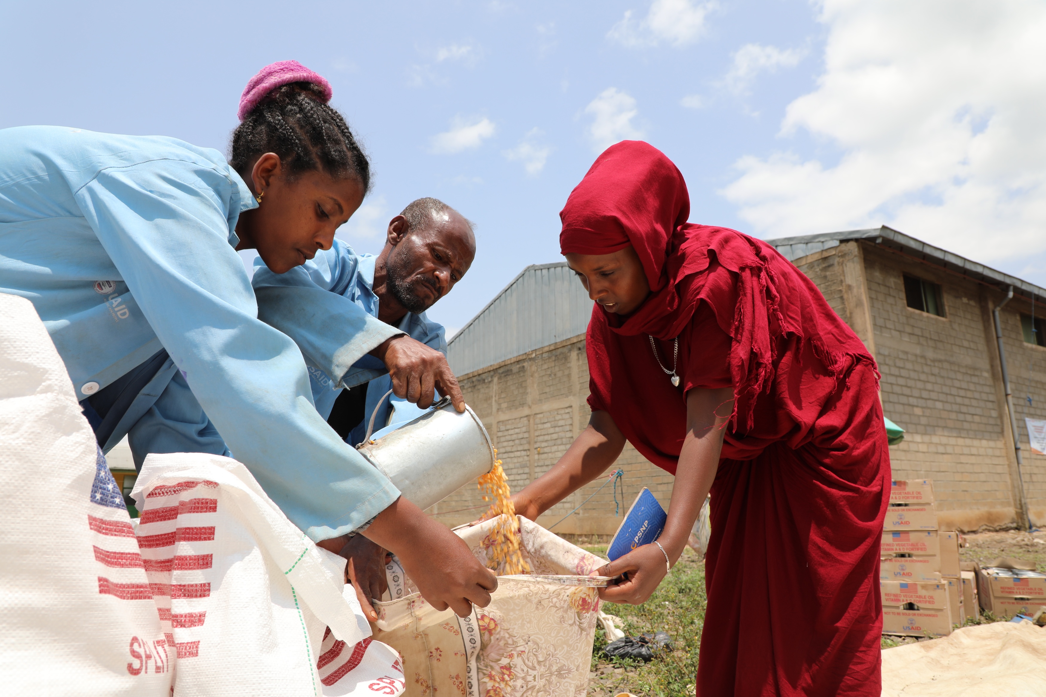 Angatu receiving food at Gelemso warehouse in Habro Woreda