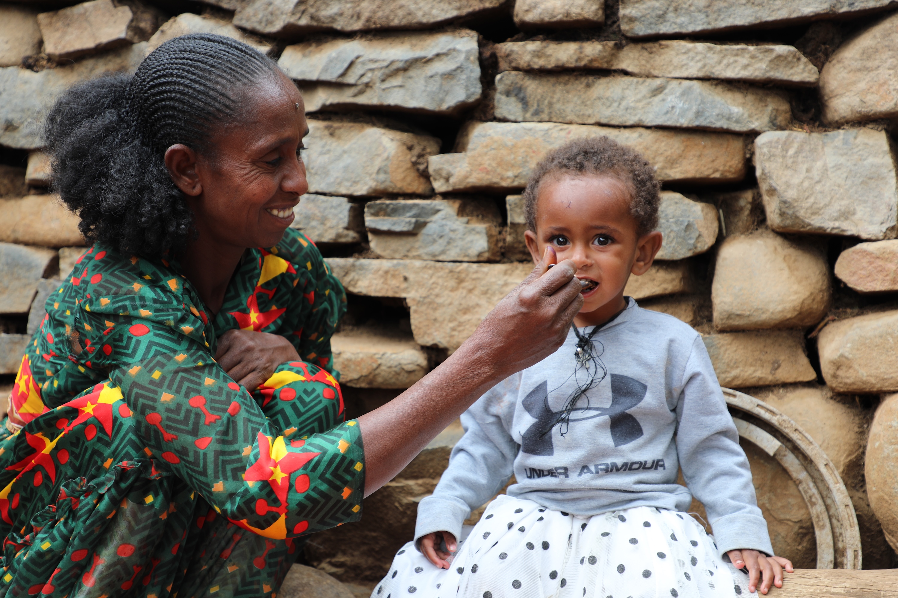 Arsema eating porridge