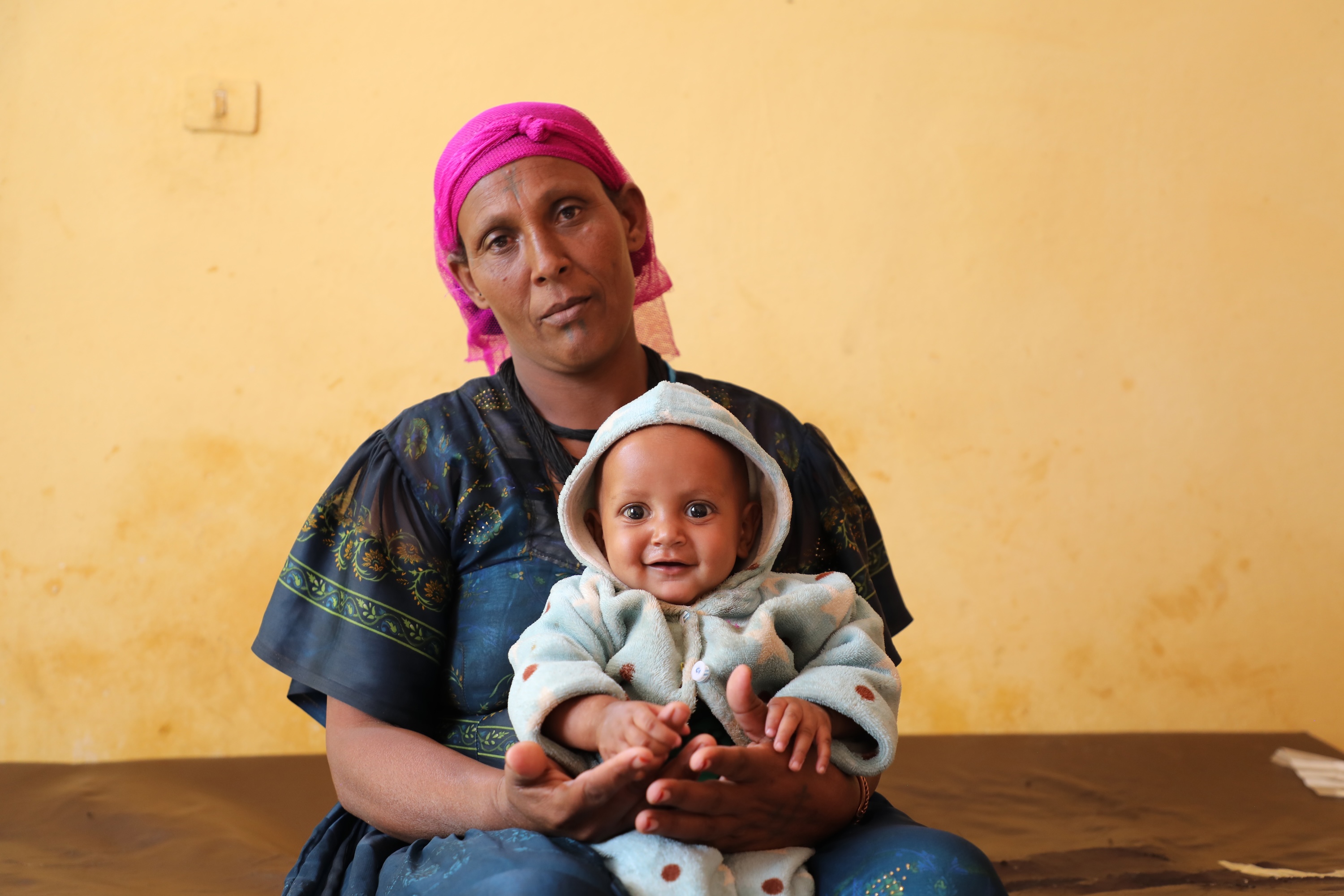 Lemlem smiling embracing her mothers hug