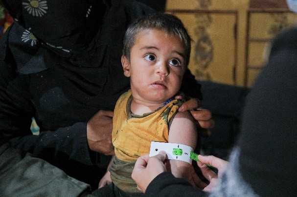 SEMA, World Vision Syria Response Partner. Zaid after receiving the medical care for severe malnutrition.