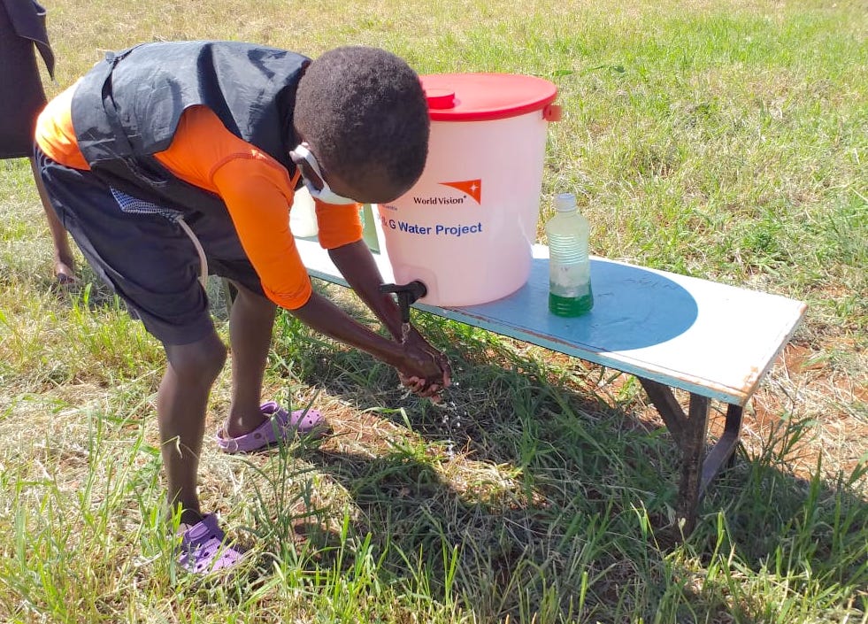 2-Elijah,10, washes hands with soap after being taught how to do it by World Vision Staff at Osiligi in Kajiado County, Kenya. This happened during a COVID-19 sensitisation forum.