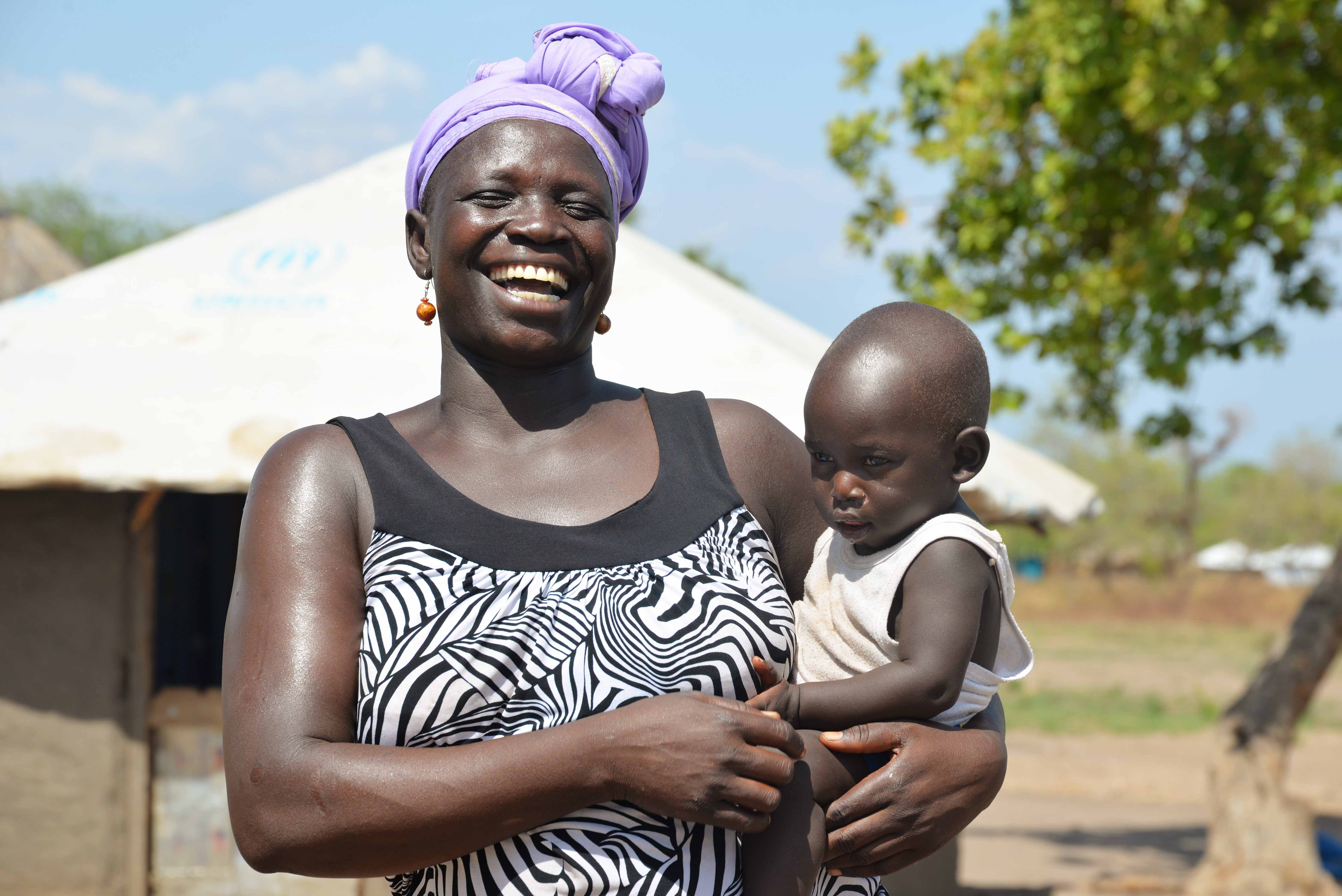 Yabang shares a light moment with one of the youngest children she looks after..JPG