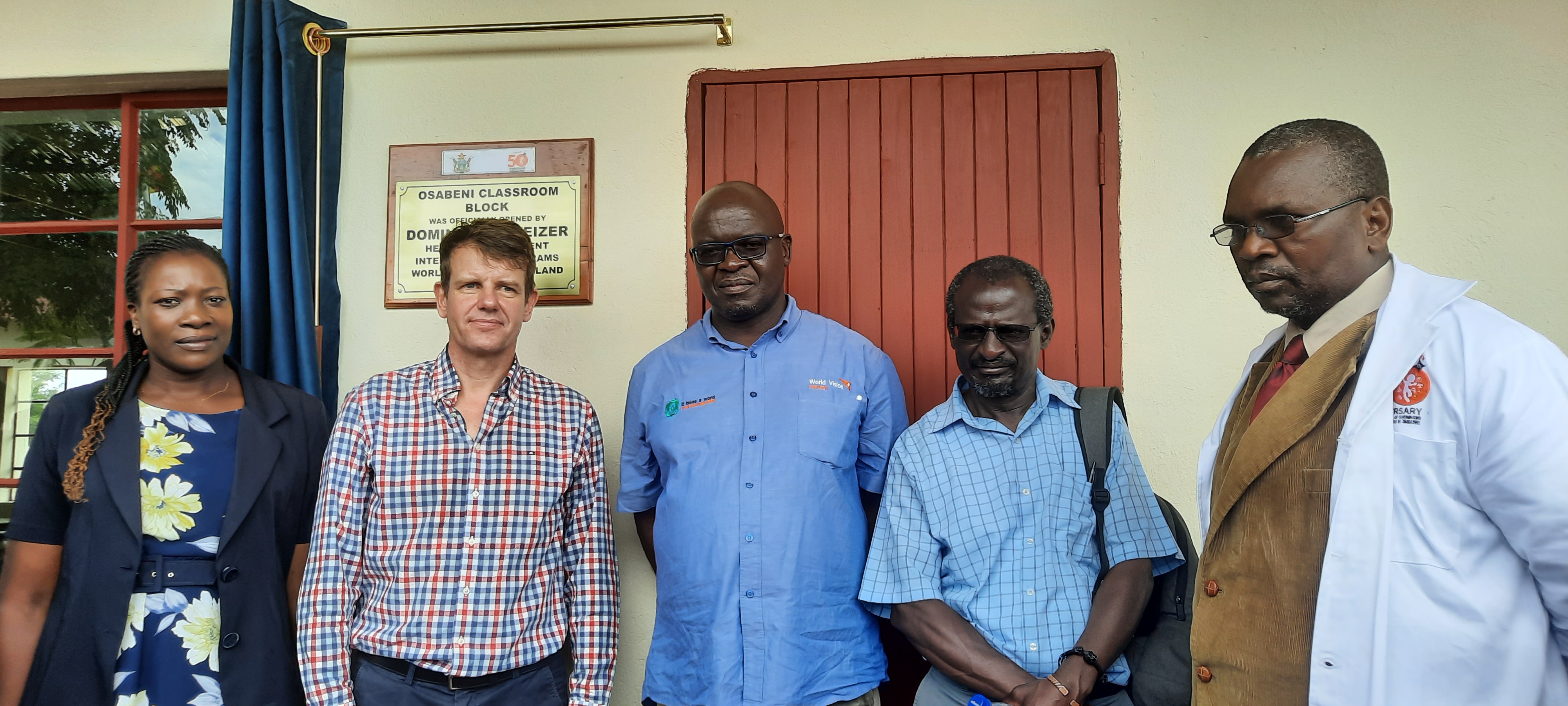 m left Grace Sibanda (Headmistress at Osabeni Primary School), Dominik Schweizer (WV Switzerland Head of International Programs), Khumbulani Ndlovu (WV Zimbabwe Operations Director), Bongani Ngwenya (Mangwe Rural District Council Chief Executive Officer) and Danisa Nkomo (Mangwe District Schools Inspector) at the handover of Osabeni Primary School ECD Classroom block