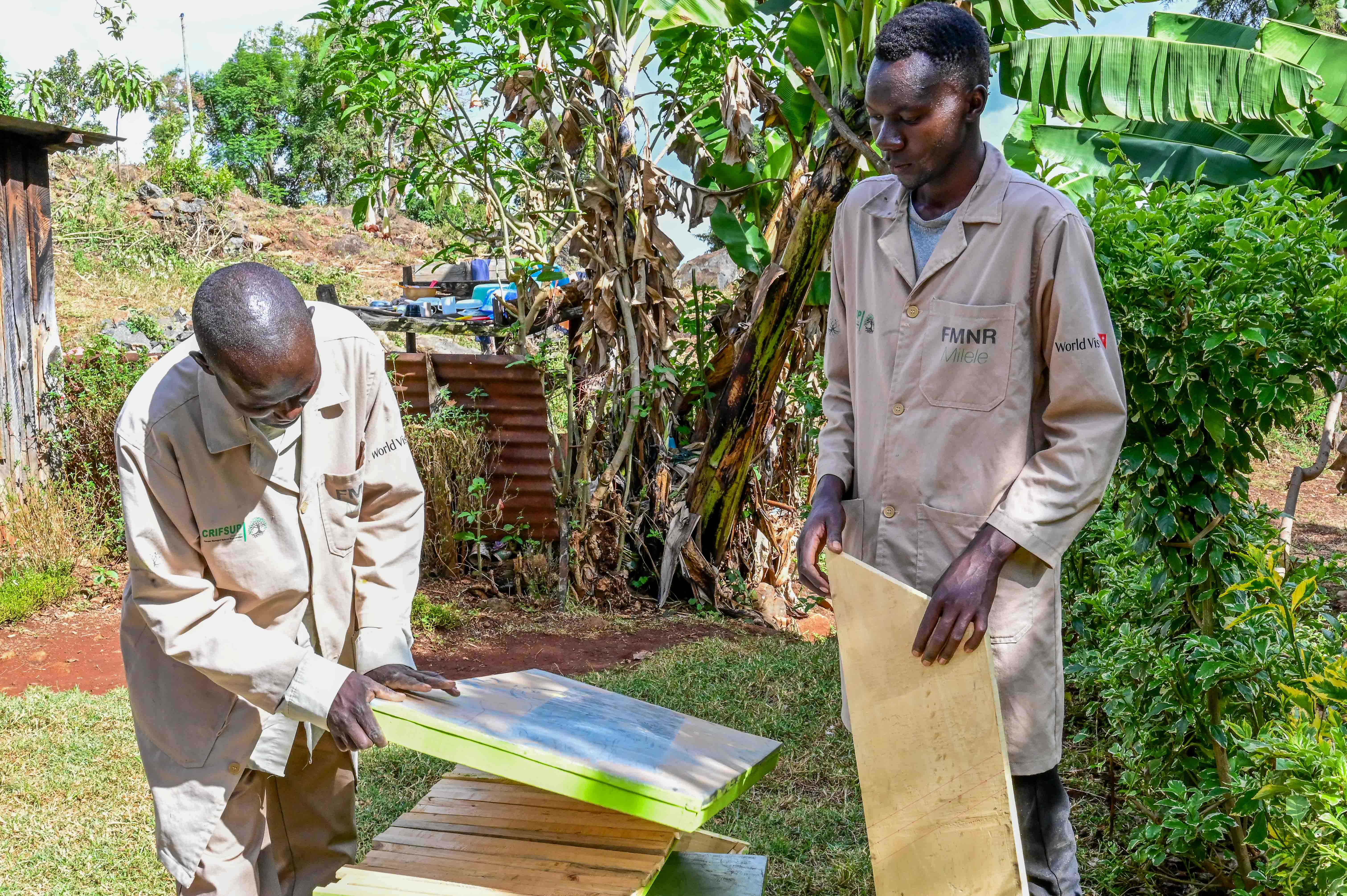 Nathan together with his group provide apiary services including beehive construction, honey harvesting, apiary maintenance, and training services to other beekeepers at a fee. ©World Vision Photo/ Hellen Owuor