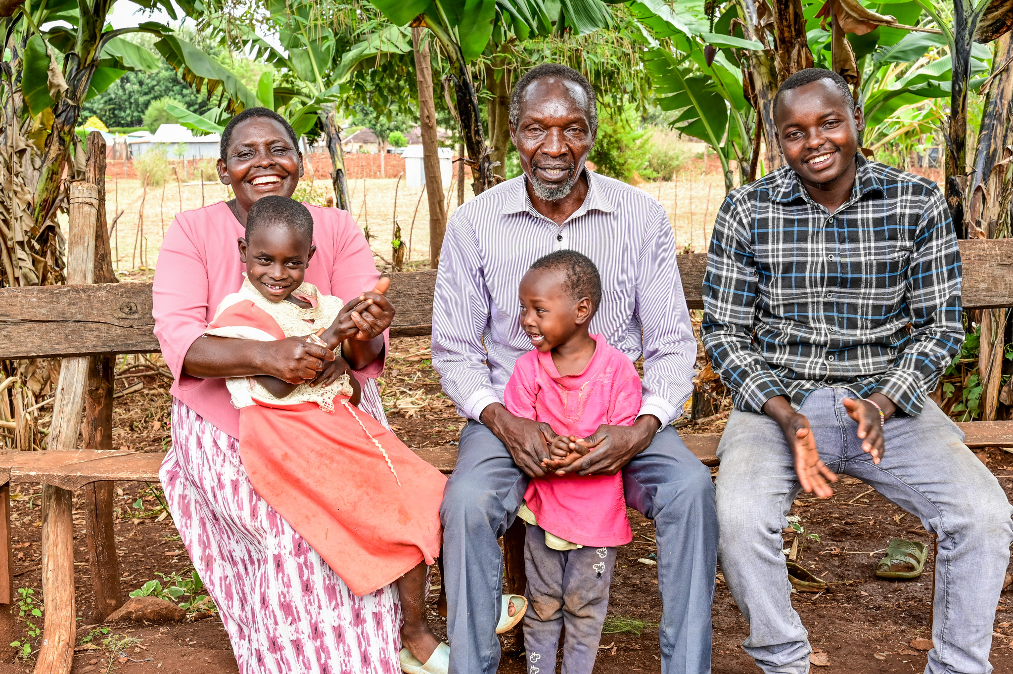 Elizabeth and Philip together with their son, Abraham and two granddaughters. They appreciate the regained joy and unity. ©World Vision Photo/ Hellen Owuor