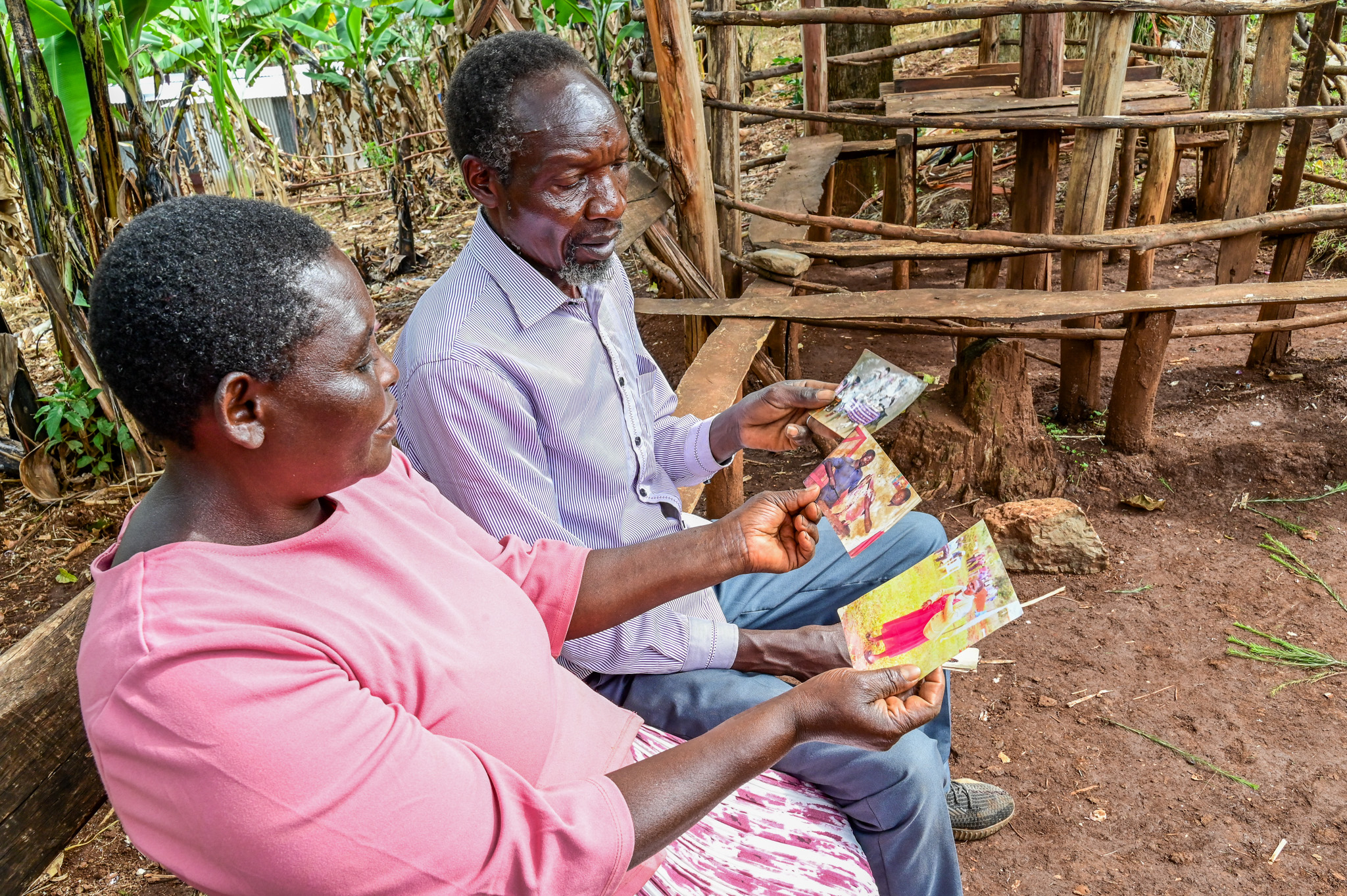 Elizabeth and Philip spend some quality time reminiscing olden days from their photos. ©World Vision Photo/ Hellen Owuor