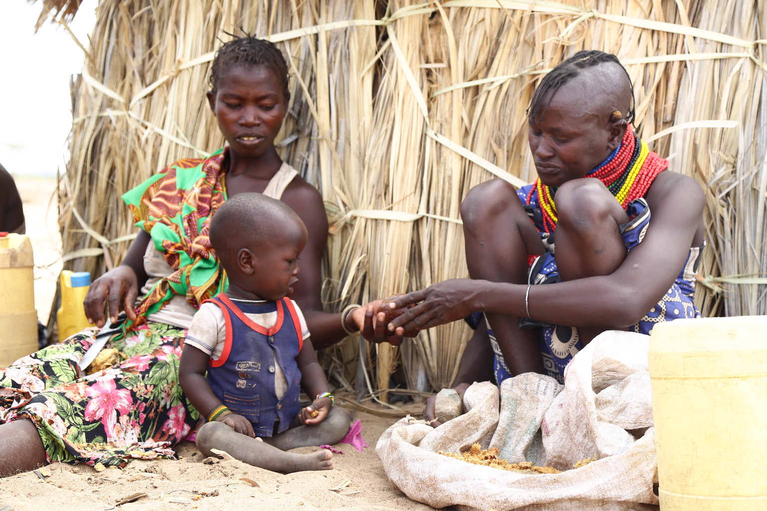 Locher prepares Duom palm fruit for her family