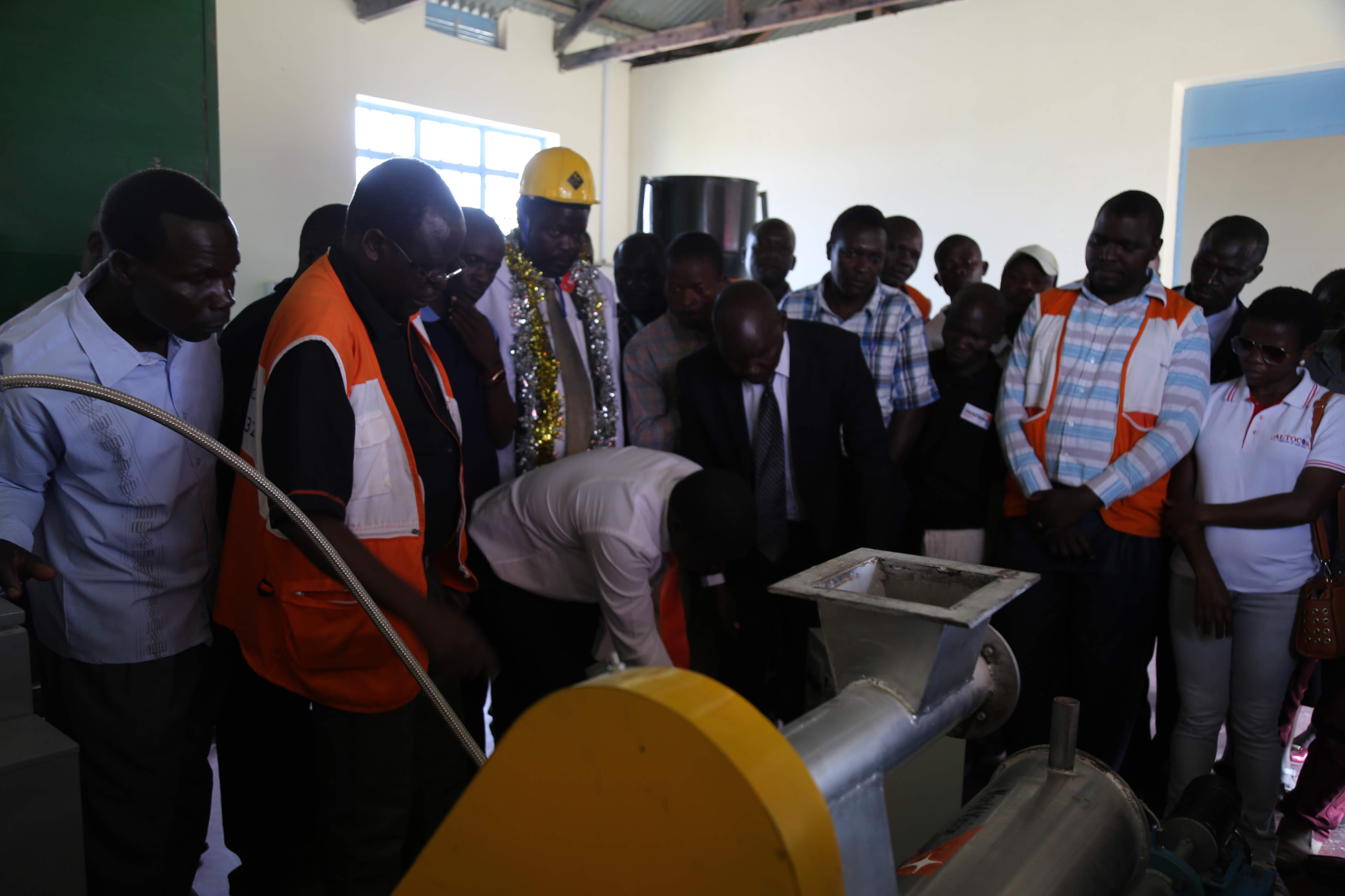 Residents of Homa Bay County enjoying a site tour of the new fish feeds processing plant by World Vision with the support from the German Federal Ministry for Economic Cooperation and Development (BMZ). ©World Vision/Photo by Zipporah Karani.