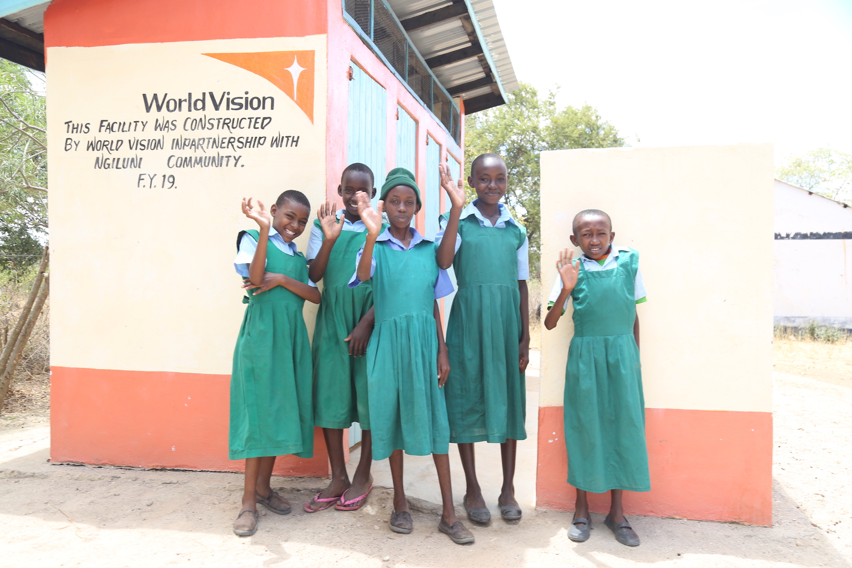 Pupils of Ngunini Primary School in Kenya's Makueni County outside the new toilet block constructed with support from World Vision. ©World Vision Photo/Hellen Owuor